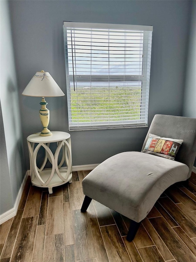 living area with hardwood / wood-style flooring