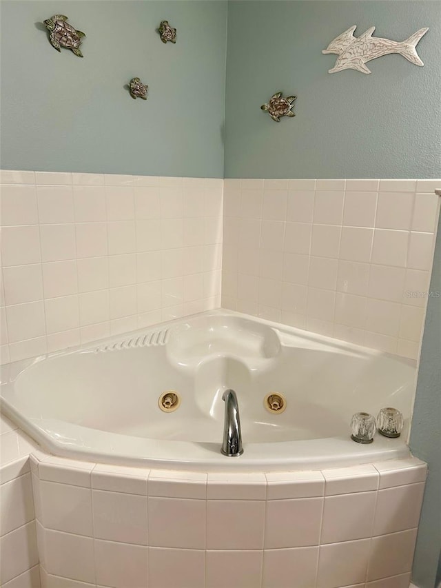 bathroom with tiled bath