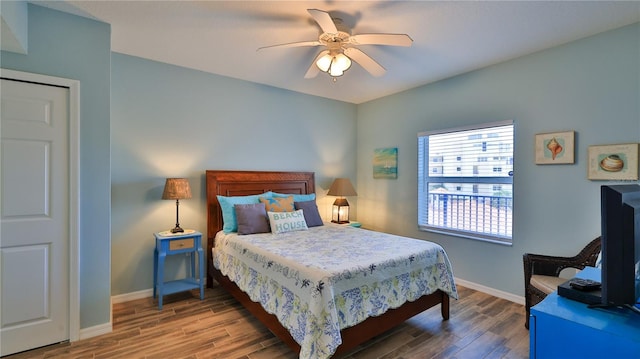 bedroom featuring ceiling fan and hardwood / wood-style flooring