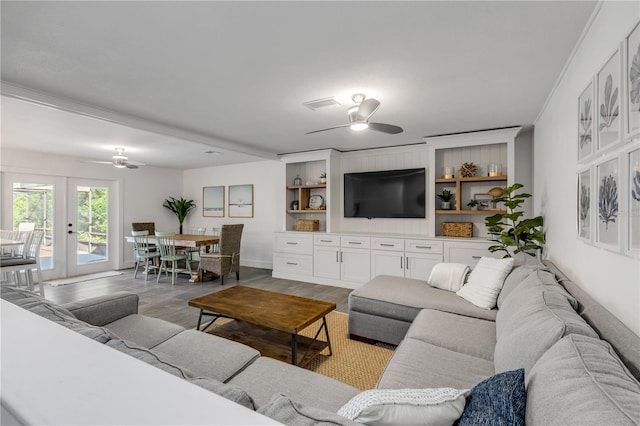 living room with ceiling fan and dark hardwood / wood-style floors