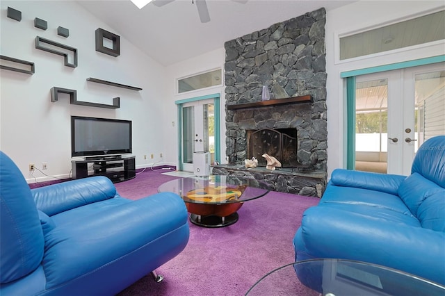 carpeted living room with french doors, ceiling fan, a fireplace, and high vaulted ceiling