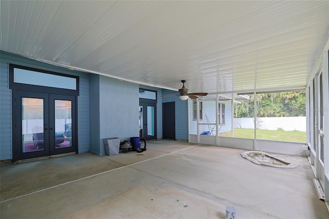 unfurnished sunroom with french doors