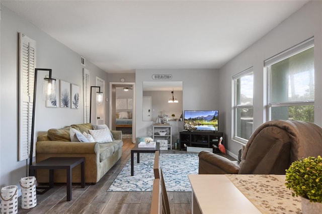 living room with dark hardwood / wood-style flooring