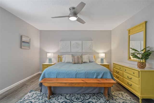 bedroom with wood-type flooring, a textured ceiling, and ceiling fan