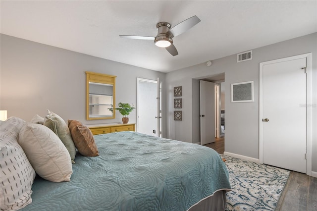 bedroom with dark wood-type flooring and ceiling fan