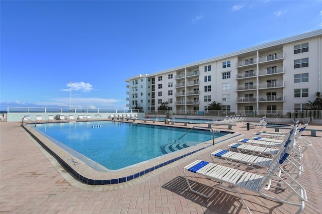 view of swimming pool with a patio