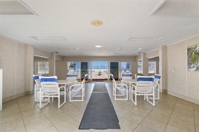 dining area featuring light tile patterned flooring