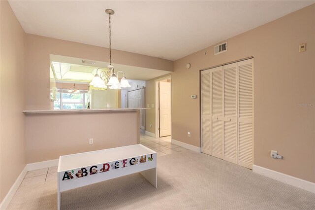 interior space with a closet and a chandelier