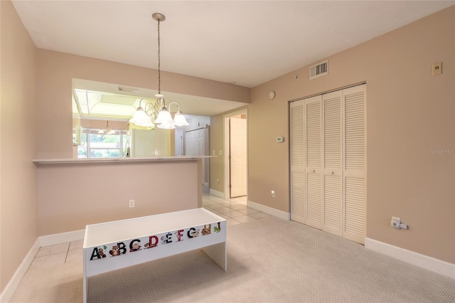 dining area featuring light colored carpet, visible vents, and baseboards