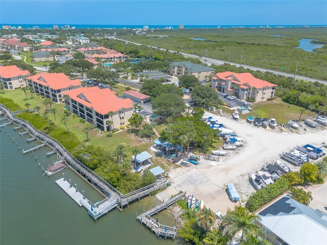 aerial view featuring a residential view and a water view