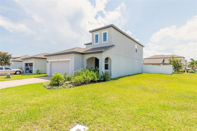 view of front of home featuring a garage and a front lawn