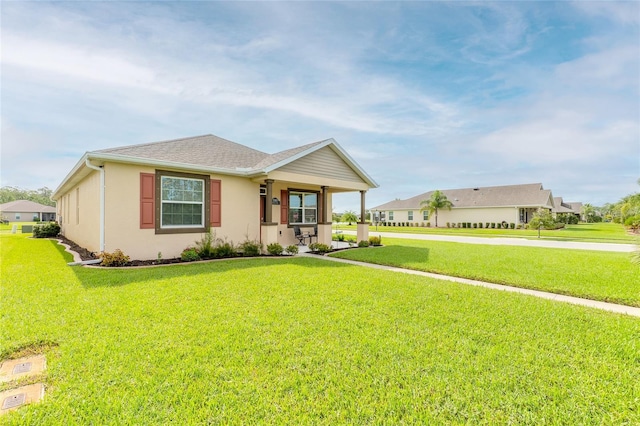 single story home featuring a front lawn and a porch