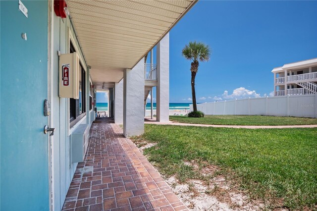 view of yard featuring a balcony and a water view