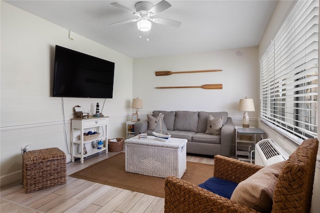 living room featuring hardwood / wood-style flooring and ceiling fan