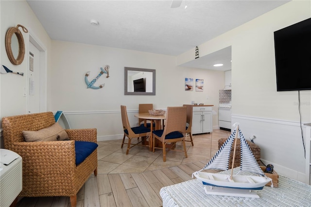 dining room featuring light wood-style floors and baseboards