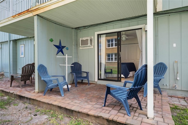 view of patio featuring a wall unit AC