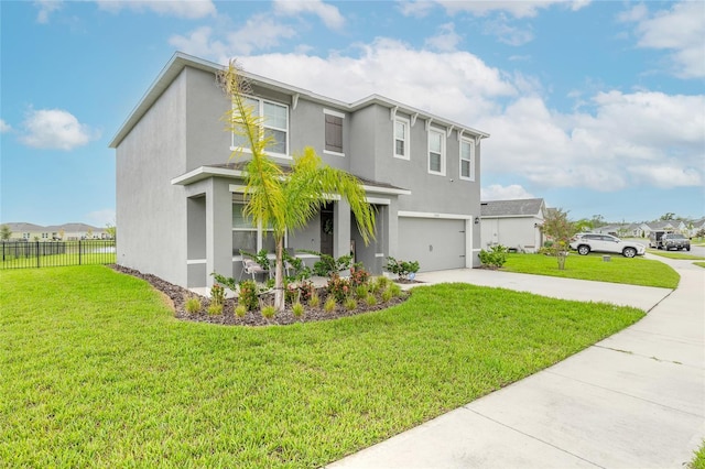 view of front of home featuring a front lawn and a garage