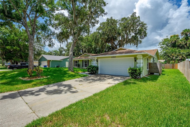 single story home with a garage and a front yard