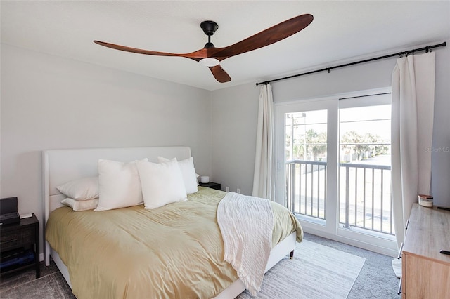 carpeted bedroom featuring ceiling fan, multiple windows, and access to outside