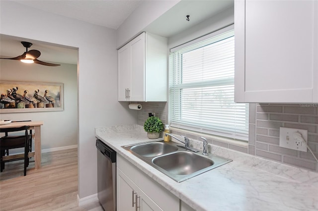 kitchen with sink, light hardwood / wood-style flooring, dishwasher, ceiling fan, and white cabinets