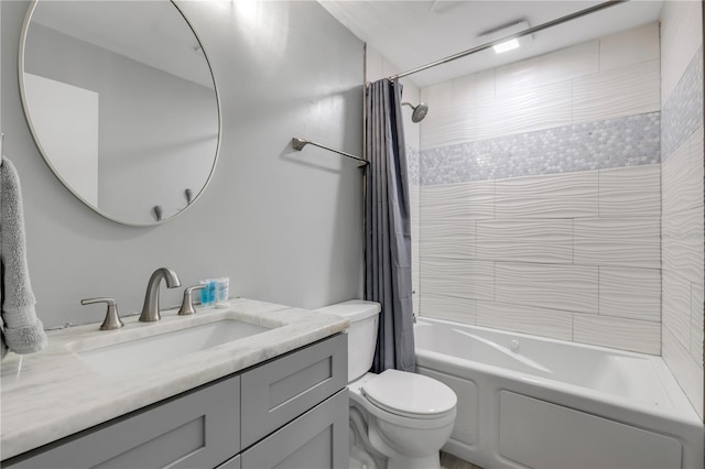 full bathroom with shower / tub combo with curtain, vanity, and toilet