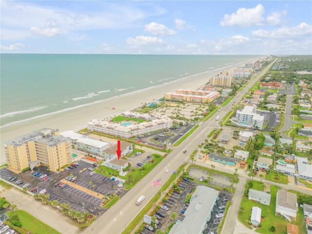 bird's eye view featuring a beach view and a water view