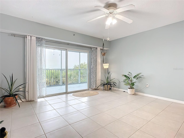 unfurnished room featuring ceiling fan and light tile patterned flooring