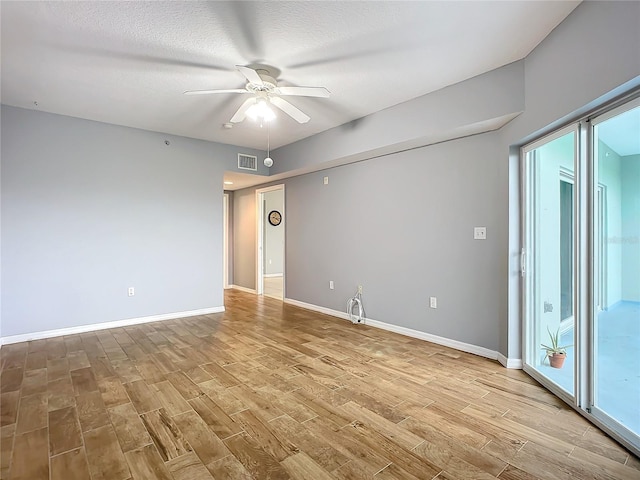 unfurnished room featuring ceiling fan, a textured ceiling, and light hardwood / wood-style floors