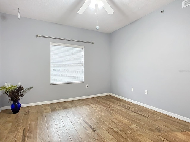 unfurnished room with hardwood / wood-style floors and ceiling fan