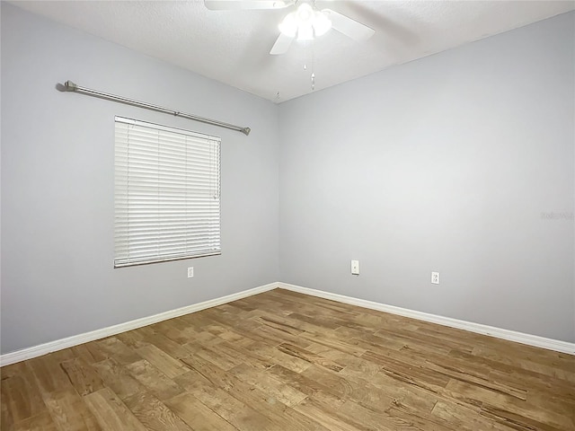 unfurnished room with a textured ceiling, light hardwood / wood-style floors, and ceiling fan