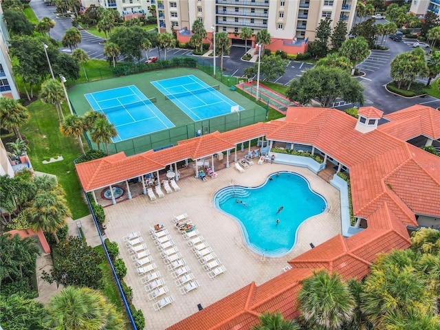 view of pool featuring a patio area and tennis court