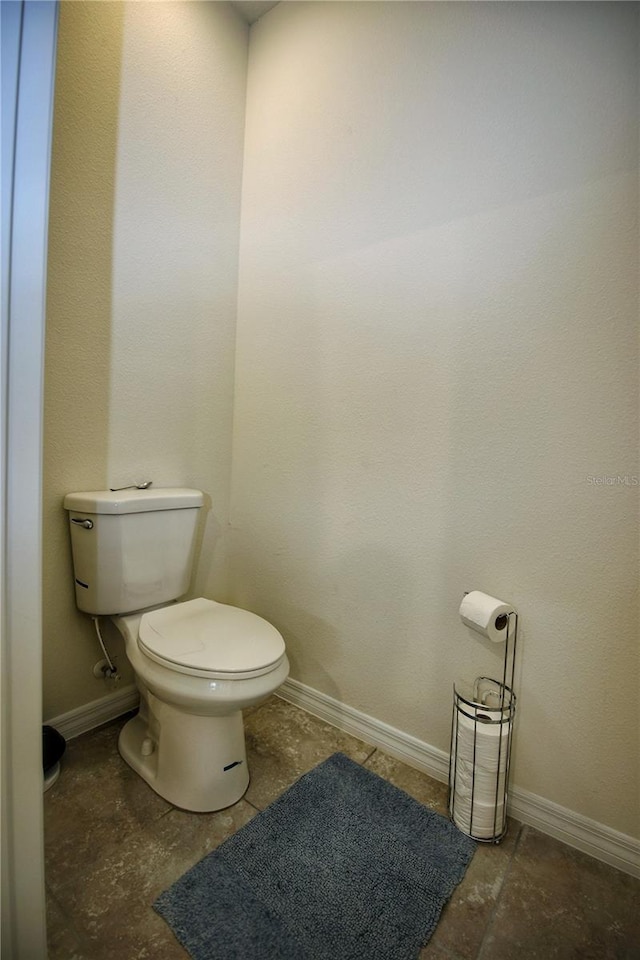 bathroom with tile patterned floors and toilet