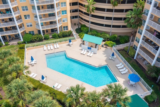 pool with fence and a patio