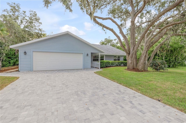 single story home with a front yard and a garage