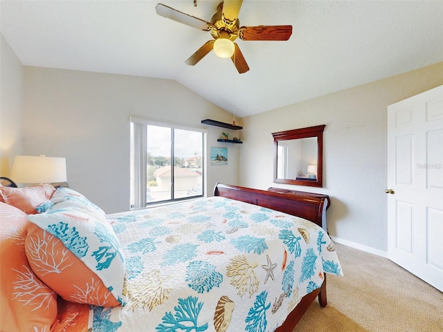 carpeted bedroom with lofted ceiling and ceiling fan