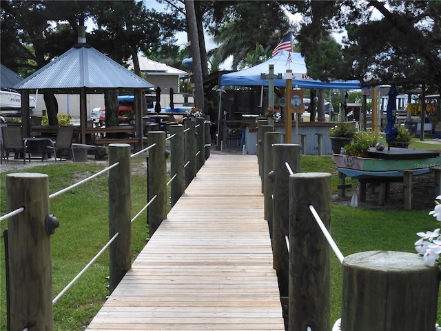 dock area featuring a lawn and a gazebo