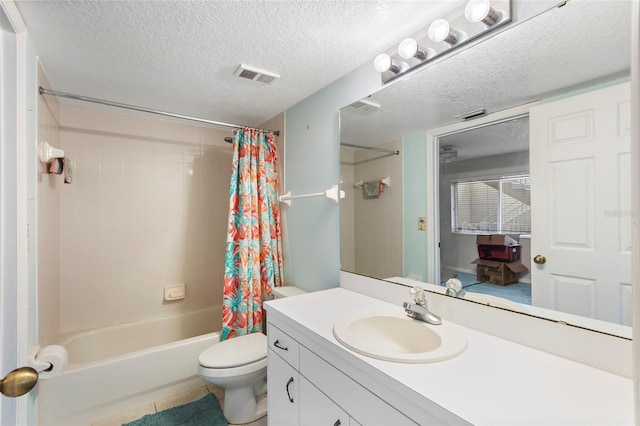 full bathroom featuring toilet, tile patterned floors, vanity, a textured ceiling, and shower / tub combo