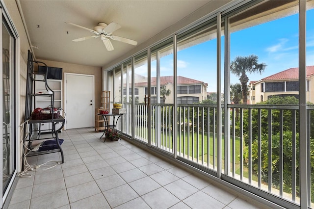 sunroom featuring ceiling fan