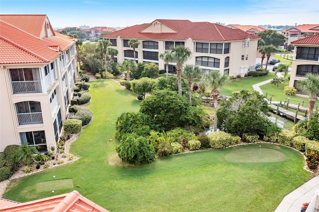 view of home's community with a lawn