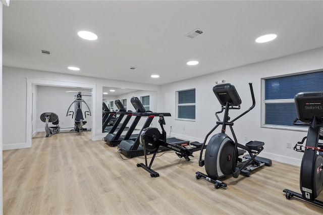 workout area featuring light hardwood / wood-style floors