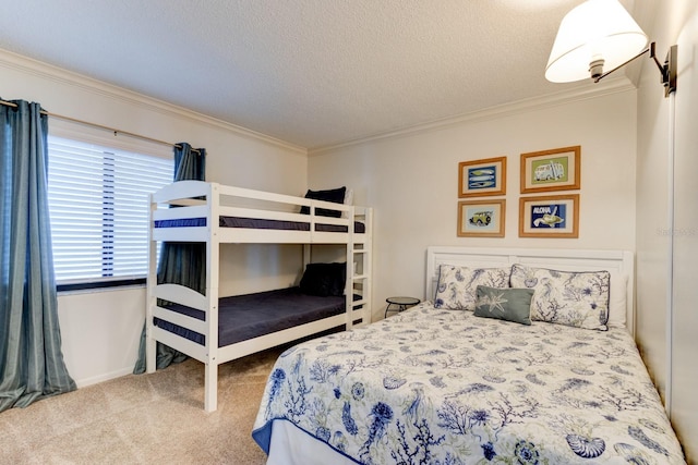 bedroom with a textured ceiling, carpet flooring, and crown molding