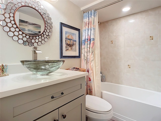 bathroom featuring shower / tub combo with curtain, vanity, and toilet