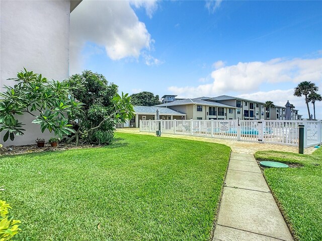 view of yard with a community pool