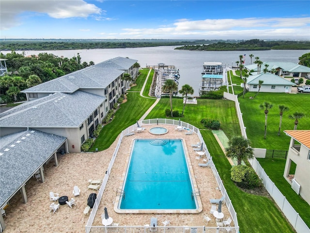 birds eye view of property featuring a water view