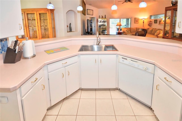 kitchen with sink, ceiling fan, dishwasher, light tile patterned floors, and white cabinets