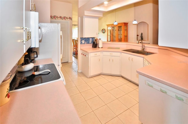 kitchen with white cabinetry, hanging light fixtures, sink, white appliances, and light tile patterned flooring