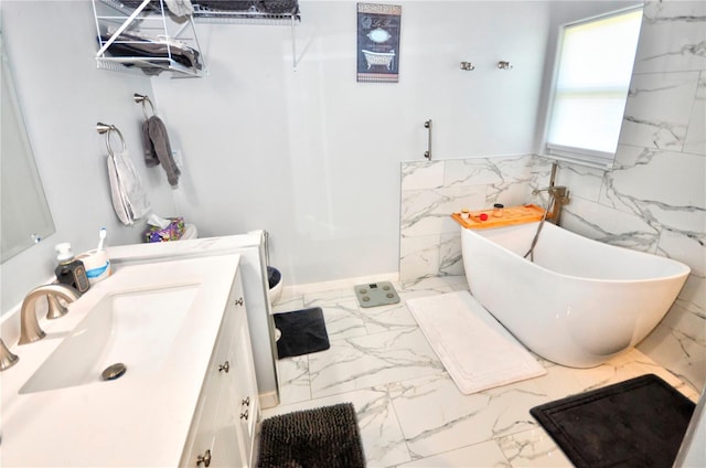 bathroom with tile walls, vanity, and tile patterned floors