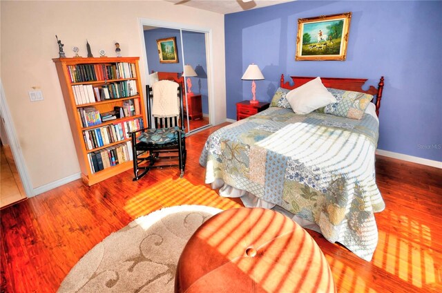 bedroom with a closet and hardwood / wood-style floors