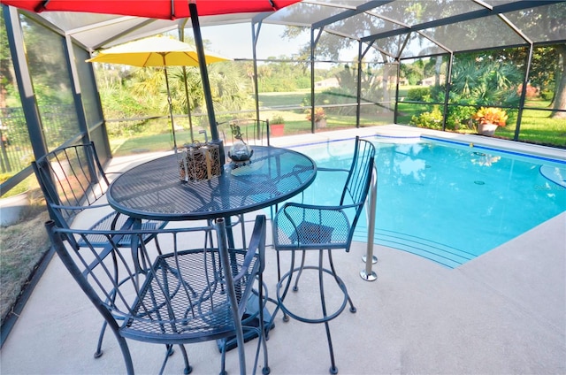 view of pool featuring a lanai and a patio