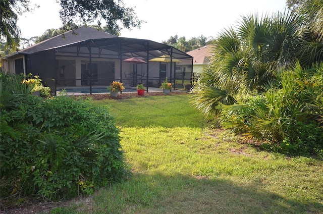 view of yard with a lanai